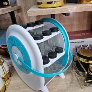 Support rotatif pour épices avec contenants en verre, idéal pour organiser votre cuisine avec style. Facile à utiliser, pratique pour ranger et accéder rapidement à vos épices préférées.